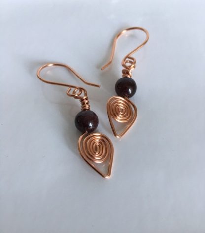 Copper coil earrings garnet