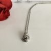 stainless-steel-and-silver-infinity-love-knot-ball-necklace