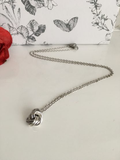 stainless-steel-and-silver-infinity-love-knot-ball-necklace
