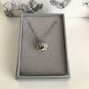 stainless-steel-and-silver-infinity-love-knot-ball-necklace
