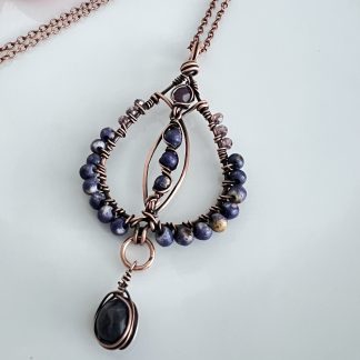 Round Copper beaded pendant with blue and amethyst beads