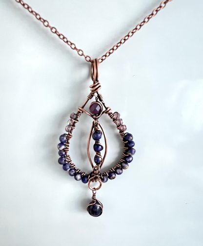 Round Copper beaded pendant with blue and amethyst beads